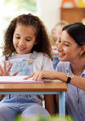 Teacher pointing to student workersheet