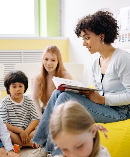 Teacher reading books to students