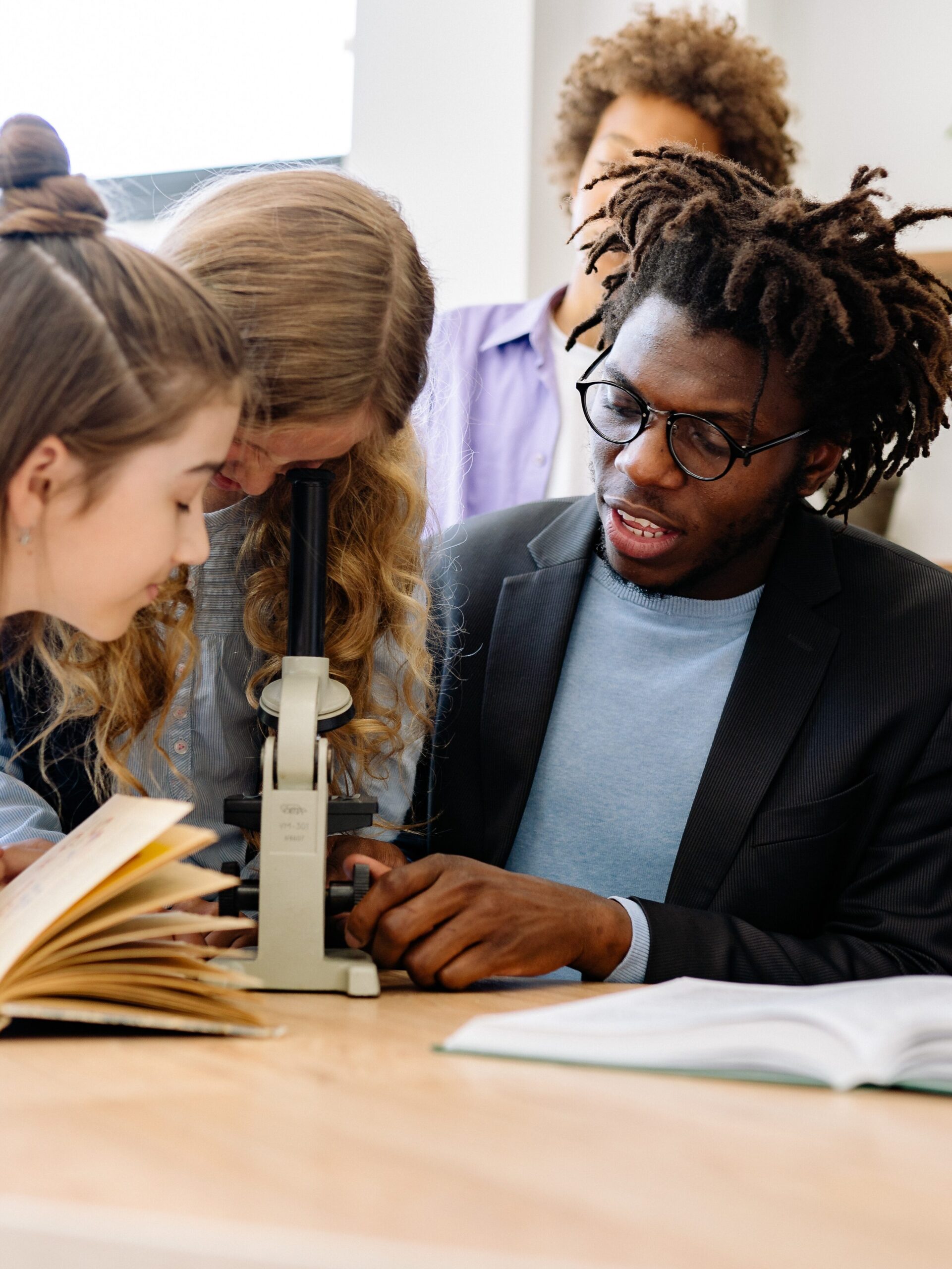 Teacher with student working on project